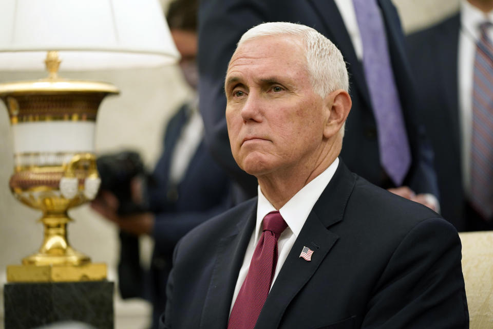 Vice President Mike Pence listens to a reporter's question during a meeting with President Donald Trump and Iraqi Prime Minister Mustafa al-Kadhimi in the Oval Office of the White House, Thursday, Aug. 20, 2020, in Washington. (AP Photo/Patrick Semansky)