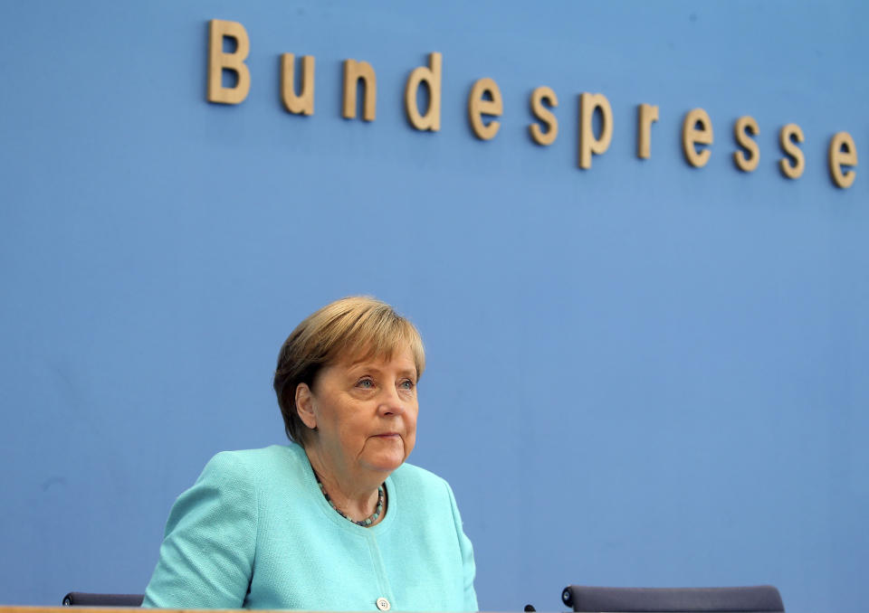 German Chancellor Angela Merkel, looks on, as she holds her annual summer news conference in Berlin, Germany, Thursday, July 22, 2021. Merkel said Thursday that new coronavirus infections in Germany are once again rising at worrying speed. She appealed to her compatriots to get vaccinated and persuade others to do so. (Wolfgang Kumm/dpa via AP)