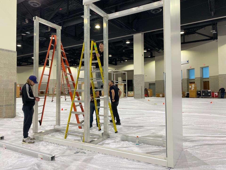 Laborers on Tuesday afternoon were in the early stages of setting up displays for the Northeast International Auto Show, which opens Friday in the Rhode Island Convention Center.