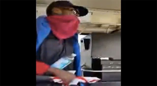 The driver alleges the male passenger she was arguing with was armed with a knife, but he is seen in the video holding a bottle of water in one hand and an umbrella in the other. Picture: YouTube