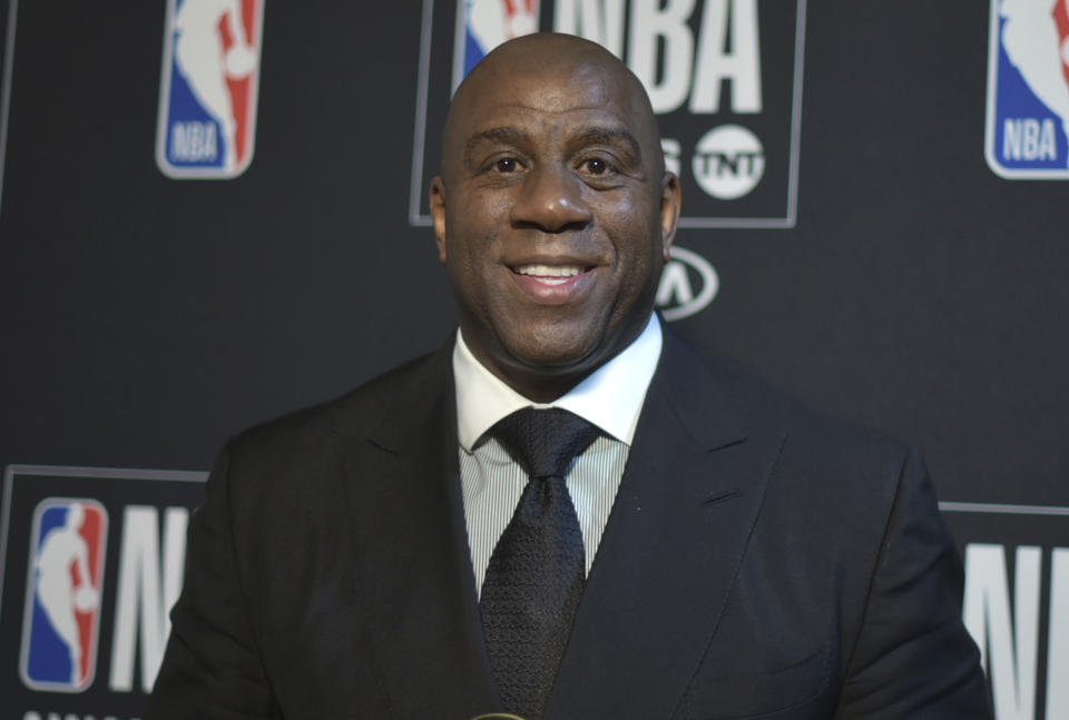 Magic Johnson poses in the press room with the lifetime achievement award at the NBA Awards on Monday, June 24, 2019, at the Barker Hangar in Santa Monica, Calif. (Photo by Richard Shotwell/Invision/AP)