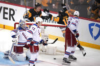 Pittsburgh Penguins' Brock McGinn (23) celebrates with Jason Zucker (16) after scoring during the first period in Game 3 of an NHL hockey Stanley Cup first-round playoff series against the New York Rangers in Pittsburgh, Saturday, May 7, 2022. (AP Photo/Gene J. Puskar)