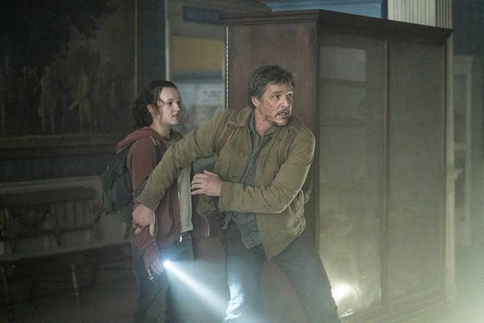 Pedro Pascal as Joel shielding Ellie, played by Bella Ramsey