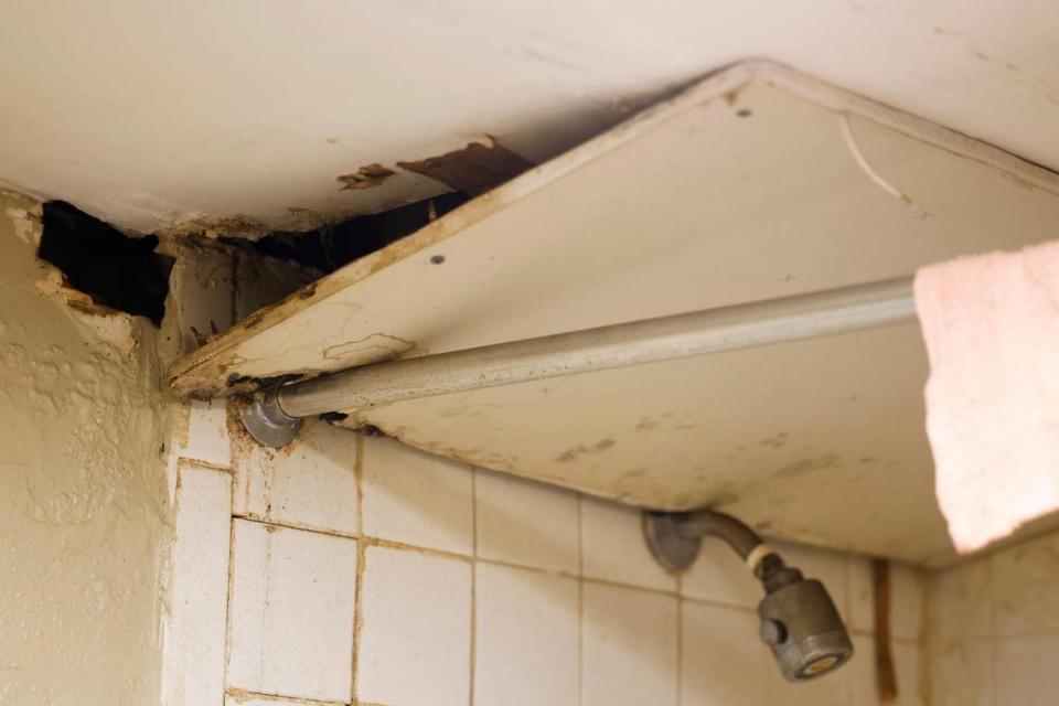 A bathroom ceiling damaged in a resident’s room at the Southern Comfort Inn in Charlotte Thursday.