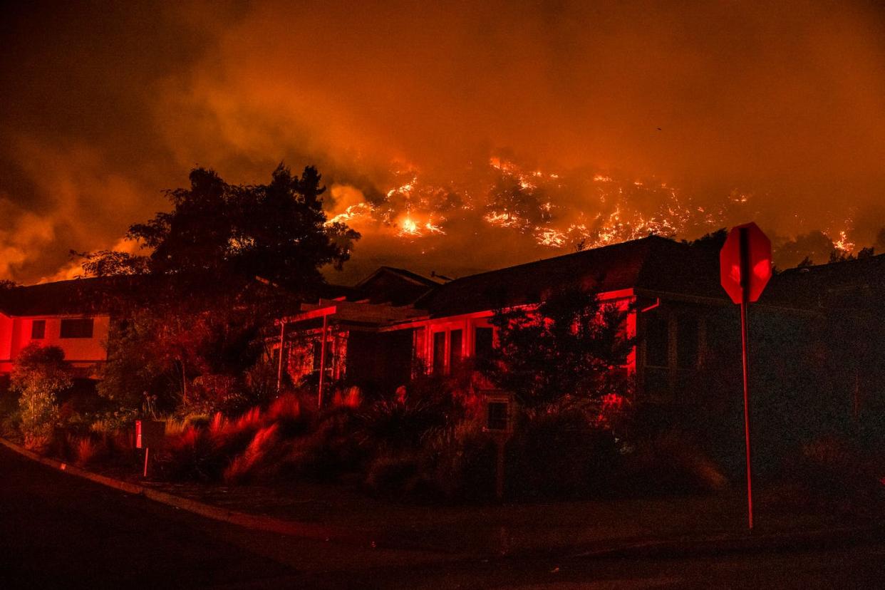 The fire risk goes beyond rising temperatures and dry conditions. <a href="https://www.gettyimages.com/detail/news-photo/the-shady-fire-can-be-seen-on-the-hillside-behind-homes-in-news-photo/1228763017" rel="nofollow noopener" target="_blank" data-ylk="slk:Samuel Corum / AFP via Getty Images;elm:context_link;itc:0;sec:content-canvas" class="link ">Samuel Corum / AFP via Getty Images</a>