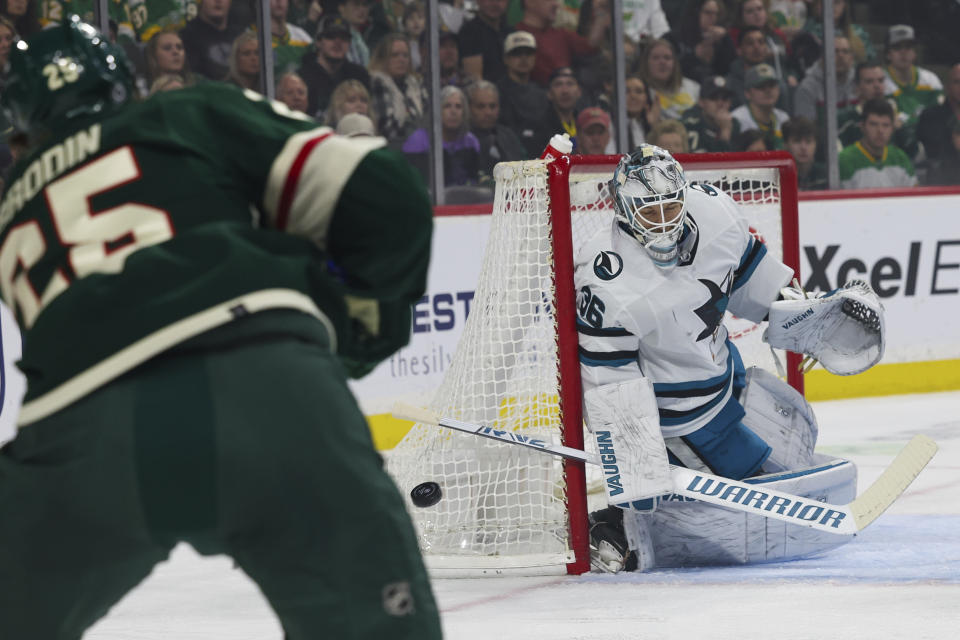 San Jose Sharks goaltender Kaapo Kahkonen protects the net against the Minnesota Wild during the first period of an NHL hockey game, Sunday, March 3, 2024, in St. Paul, Minn. (AP Photo/Stacy Bengs)