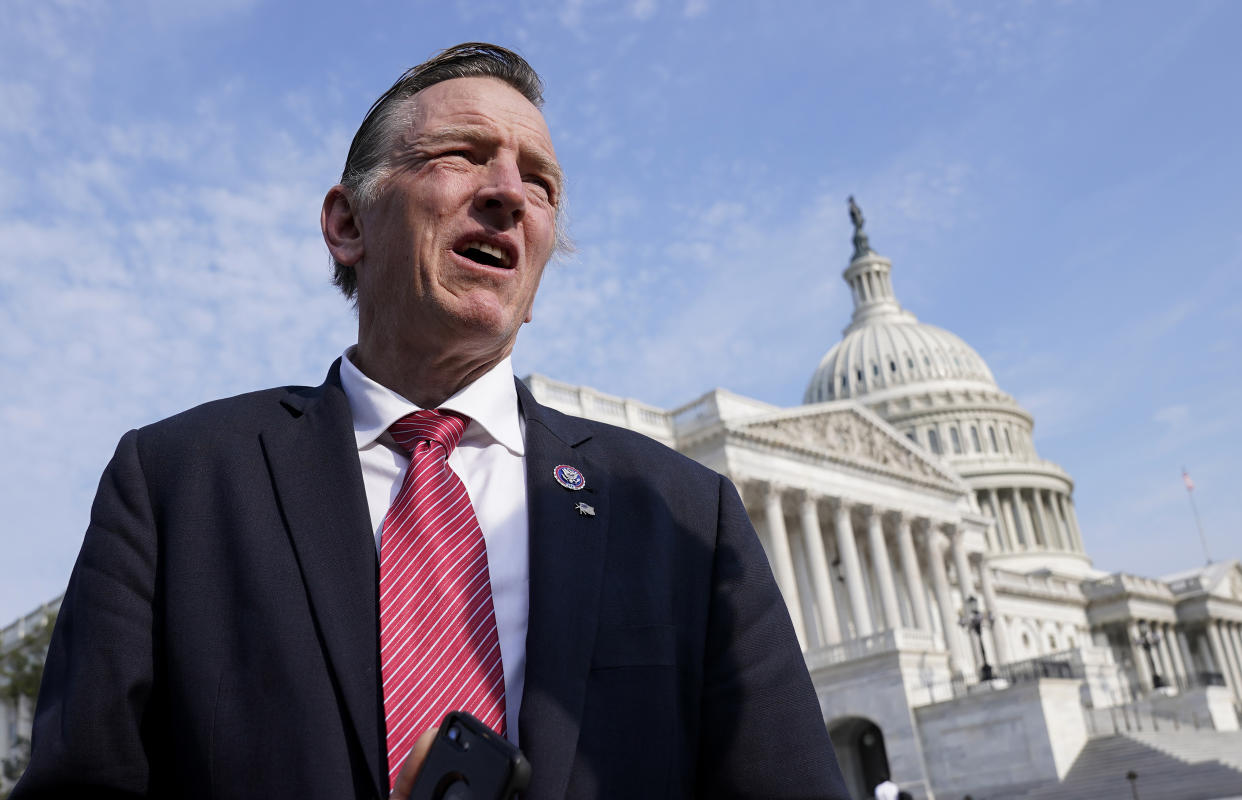 FILE - Rep. Paul Gosar, R-Ariz., waits for a news conference about the Delta variant of COVID-19 and the origin of the virus, at the Capitol in Washington, on July 22, 2021. In the past week, Gosar tweeted a video showing a character with his face killing a figure with Rep. Alexandria Ocasio-Cortez's face. Several of the 13 House Republicans who backed a bipartisan infrastructure bill said they faced threats after their vote. In one profanity-laced voicemail, a caller labeled Rep. Fred Upton a “traitor” and wished death for the Michigan Republican, his family and staff.  (AP Photo/J. Scott Applewhite, File)