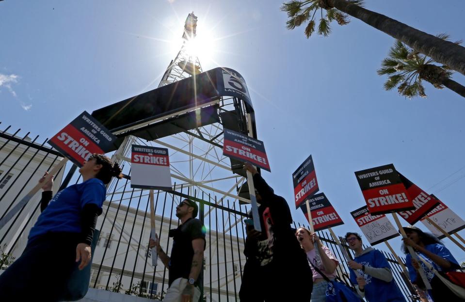 Striking Writers Guild of America workers picket outside the Sunset Bronson Studios on May 2.