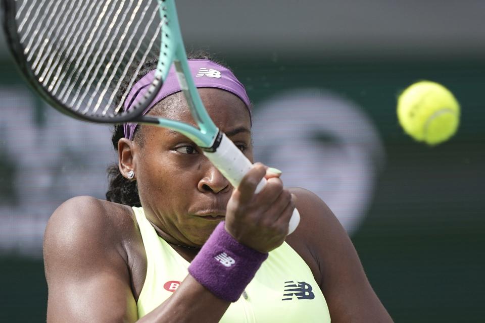 Coco Gauff, of the United States, returns a shot to Lucia Bronzetti, of Italy, at the BNP Paribas Open tennis tournament Monday, March 11, 2024, in Indian Wells, Calif. (AP Photo/Mark J. Terrill)