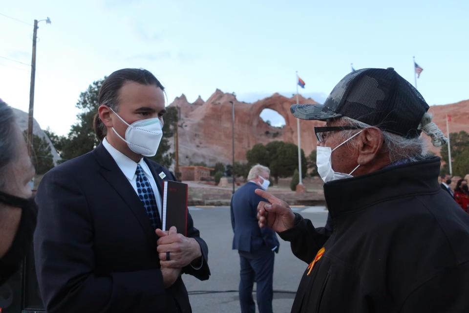 Bryan Newland, left, speaks with Navajo Nation Council Delegate Daniel Tso on Thursday, April 22, 2021 in Window Rock, Ariz. Biden nominated Newland on Thursday to be assistant secretary for Indian Affairs in the Interior Department. (AP Photo/Felicia Fonseca)