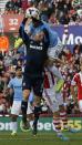 Stoke City's Robert Huth (bottom R) is kneed in the face by Manchester City's Alvaro Negredo (9) as Stoke City's Asmir Begovic catches the ball during their English Premier League soccer match at the Brittania Stadium in Stoke-on-Trent September 14, 2013.