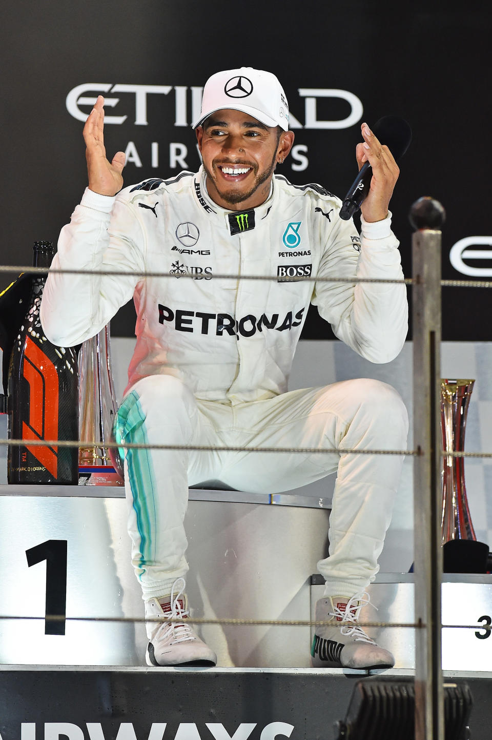 Take a break: Lewis Hamilton looked happy but worn out after the last race of the 2017 F1 season, at Abu Dhabi’s Yas Marina Circuit