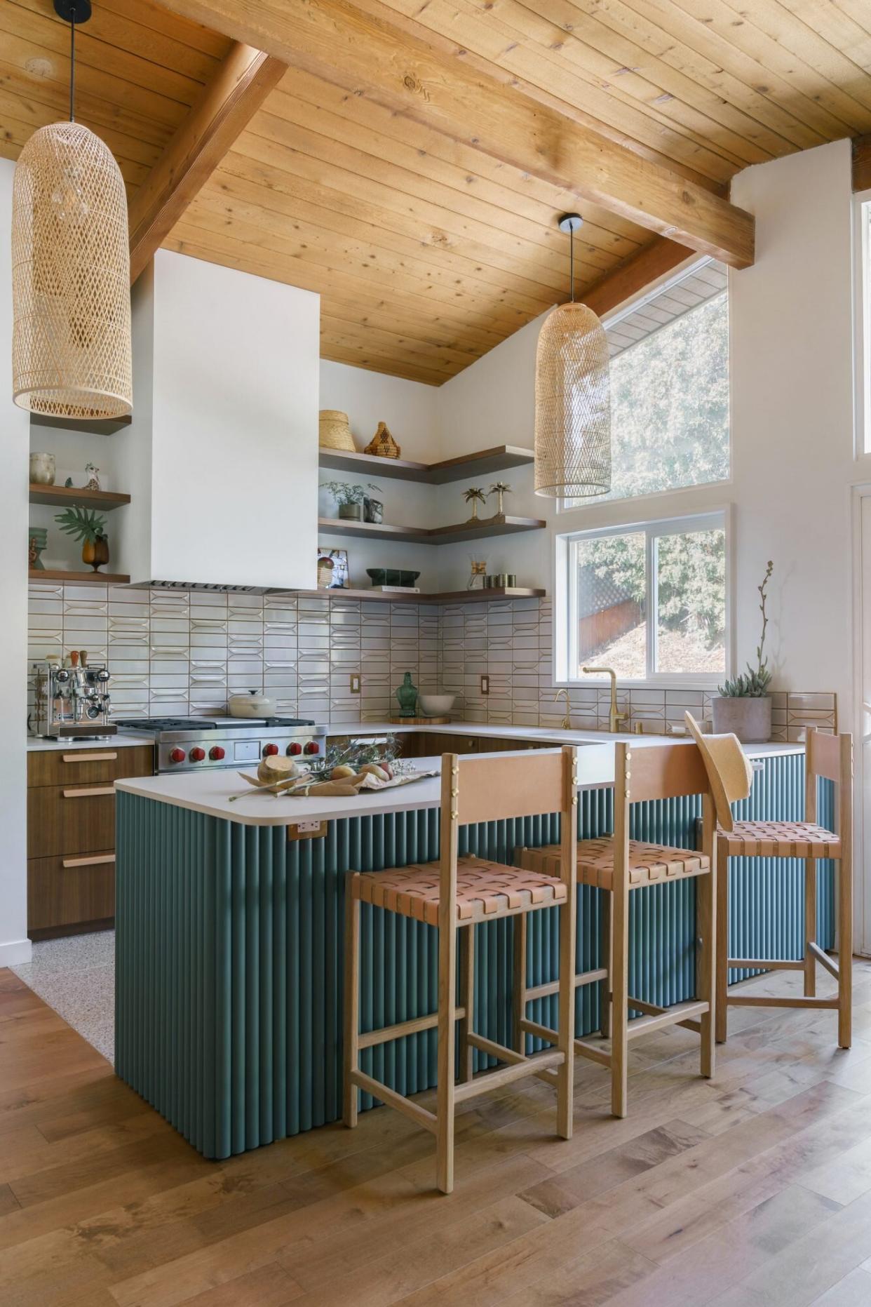 Midcentury modern kitchen with teal textured island and open shelving