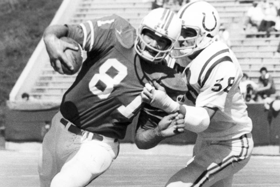 Russ Francis, left, in action against the Baltimore Colts in 1976 in Foxboro.