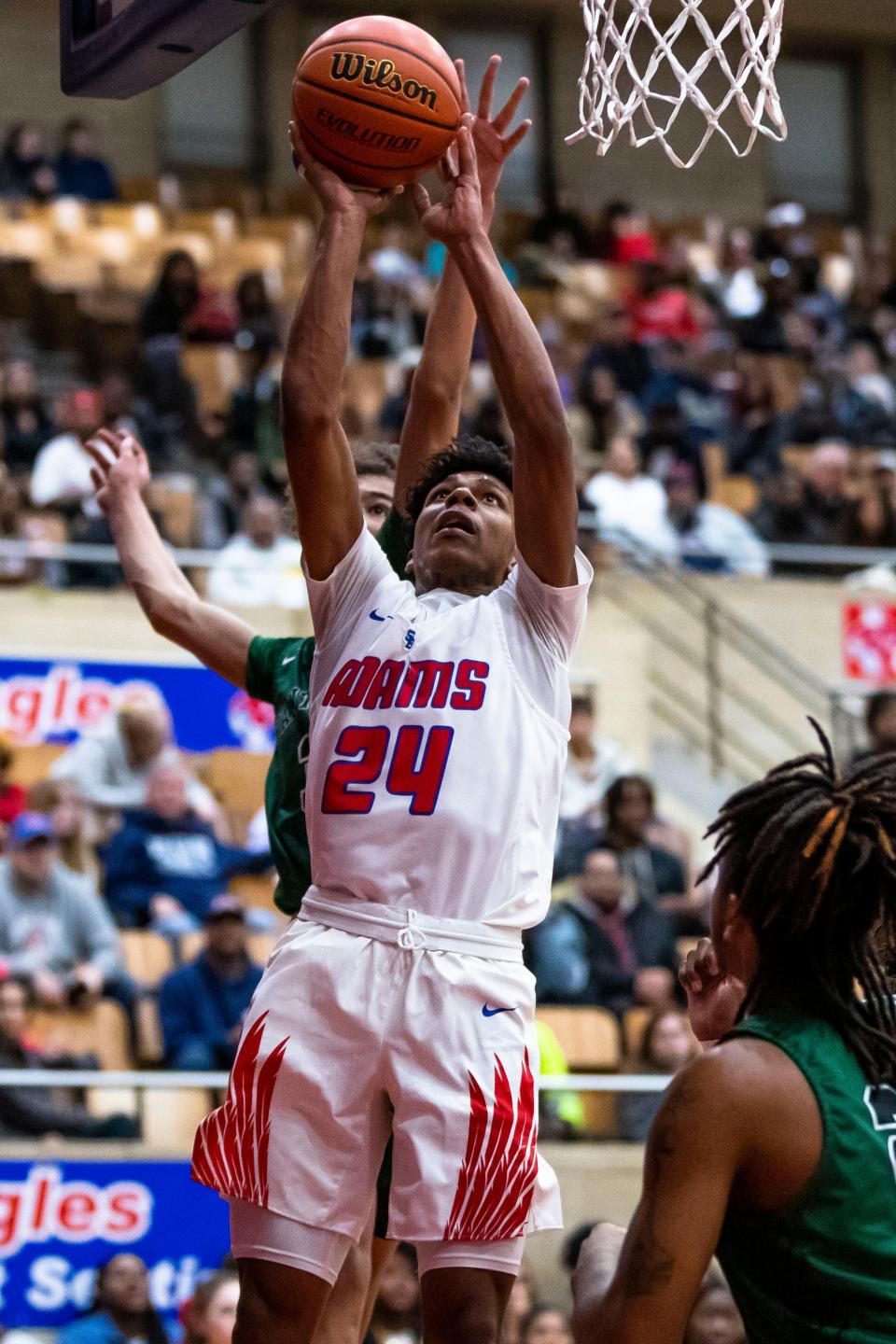 Adams' Brittain Vann (24) shoots during the Adams vs. Washington boys basketball game Thursday, Jan. 12, 2023 at Adams High School.