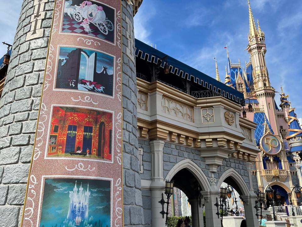 cinderella panels on castle at disney world during 50th anniversary