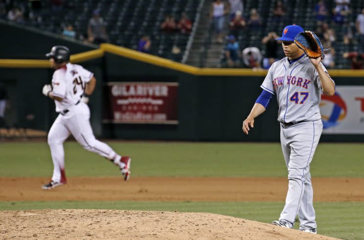 Hansel Robles did not have a good night Monday. (AP Photo)