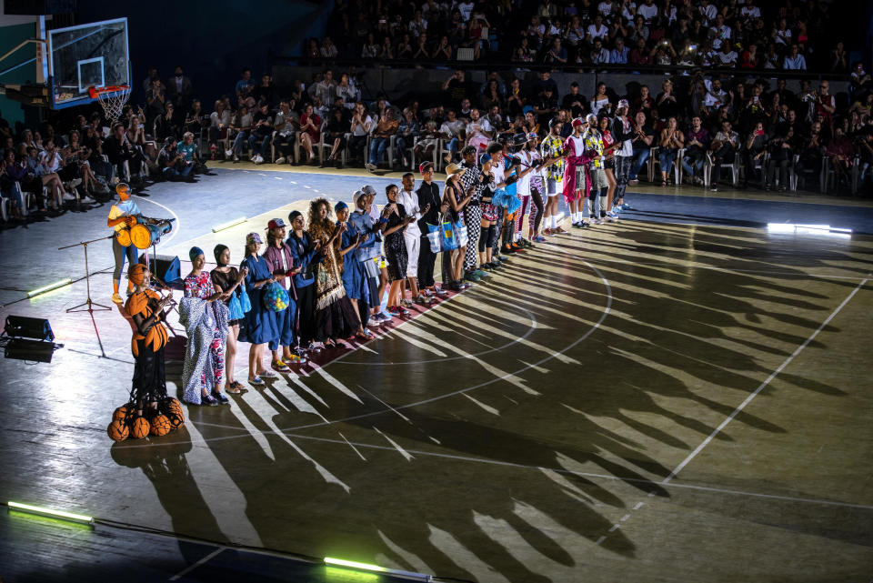 Models wear creations from "Clandestina," the first Cuban independent urban fashion brand, during a launch for the 2020 collection called Sports Glories in Havana, Cuba, Friday, Nov. 22, 2019. (AP Photo/Ramon Espinosa)