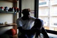 Congolese basketball player Christ Wamba sits in his room in an apartment building, provided under the UNHCR's ESTIA housing programme in Thessaloniki, Greece, September 13, 2018. REUTERS/Alkis Konstantinidis