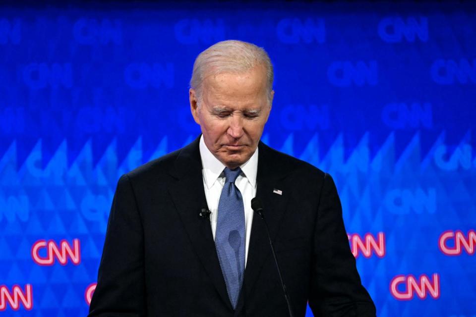 PHOTO: President Joe Biden looks down as he participates in the first presidential debate of the 2024 elections with former President Donald Trump at CNN's studios in Atlanta, GA, on June 27, 2024.  (Andrew Caballero-Reynolds/AFP via Getty Images)