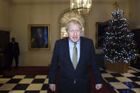 Britain's Prime Minister Boris Johnson leaves 10 Downing Street to travel to Buckingham Palace, London, to meet with Queen Elizabeth II on Friday, Dec. 13, 2019. Prime Minister Boris Johnson's Conservative Party has won a solid majority of seats in Britain's Parliament — a decisive outcome to a Brexit-dominated election that should allow Johnson to fulfil his plan to take the U.K. out of the European Union next month. (Stefan Rousseau/Pool via AP)