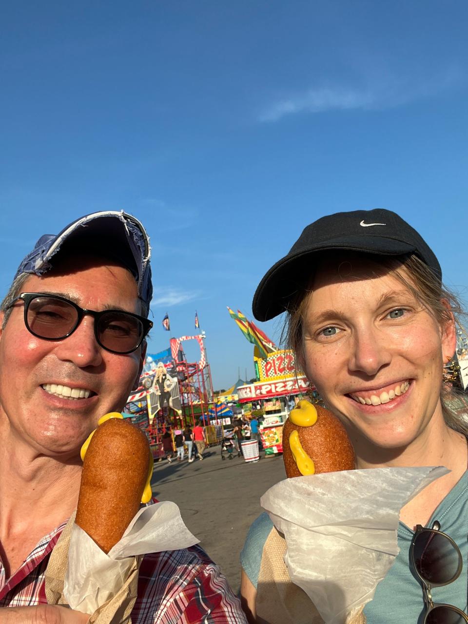 The Wilson County - TN State Fair, held August 15-24, broke attendance records for 2024. More than 860,000 visitors attended. Pictured are Der SPIEGEL reporter Angela Gruber and The Tennessean's Opinion and Engagement Director David Plazas enjoying corn dogs.