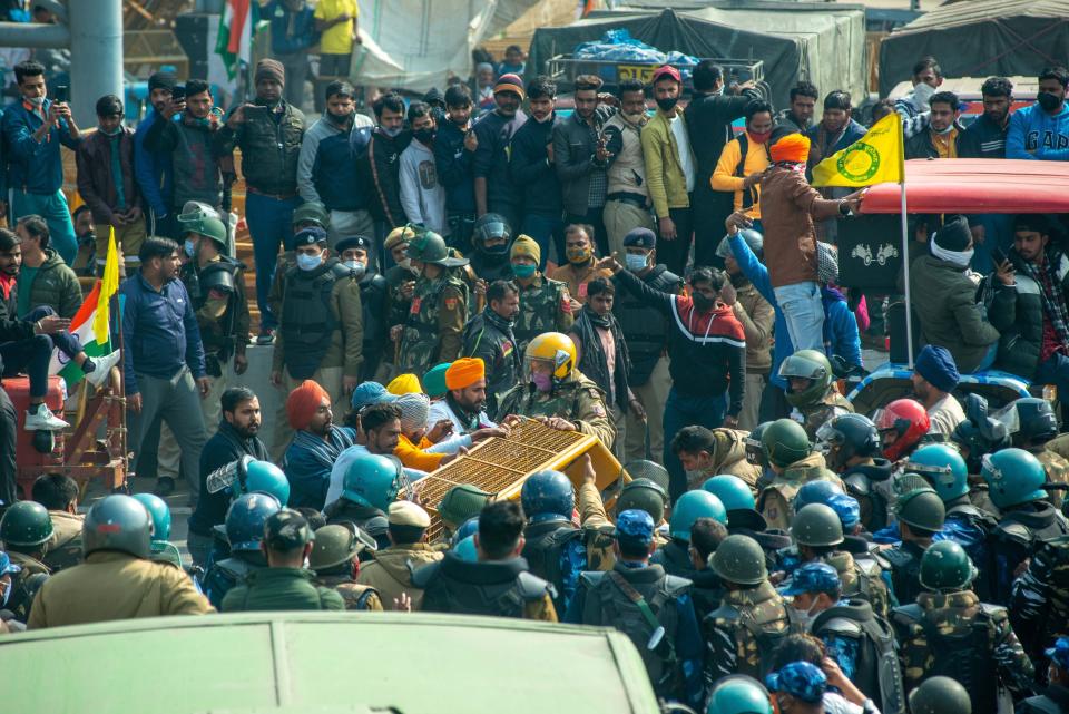 Farmers clash with police near Akshardham temple during the...