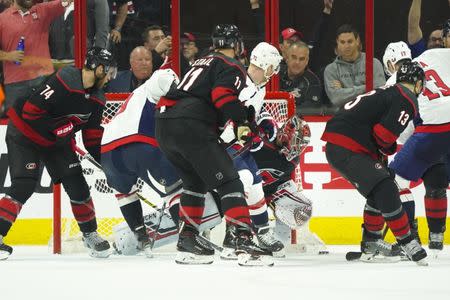 Apr 18, 2019; Raleigh, NC, USA; Carolina Hurricanes goaltender Petr Mrazek (34) makes a third period save against the Washington Capitals in game four of the first round of the 2019 Stanley Cup Playoffs at PNC Arena. The Carolina Hurricanes defeated the Washington Capitals 2-1. Mandatory Credit: James Guillory-USA TODAY Sports