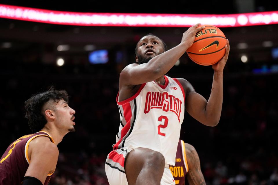 Jan 12, 2023; Columbus, Ohio, USA;  Ohio State Buckeyes guard Bruce Thornton (2) leaps for a shot attempt while Minnesota Golden Gophers forward Dawson Garcia (3) defends during the first half of the men’s NCAA division I basketball game between the Ohio State Buckeyes and the Minnesota Golden Gophers at Value City Arena. Mandatory Credit: Joseph Scheller-The Columbus Dispatch