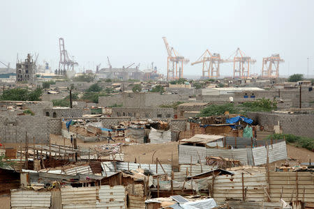 FILE PHOTO: Hodeidah port's cranes are pictured from a nearby shantytown in Hodeidah, Yemen June 16, 2018. REUTERS/Abduljabbar Zeyad/File Photo