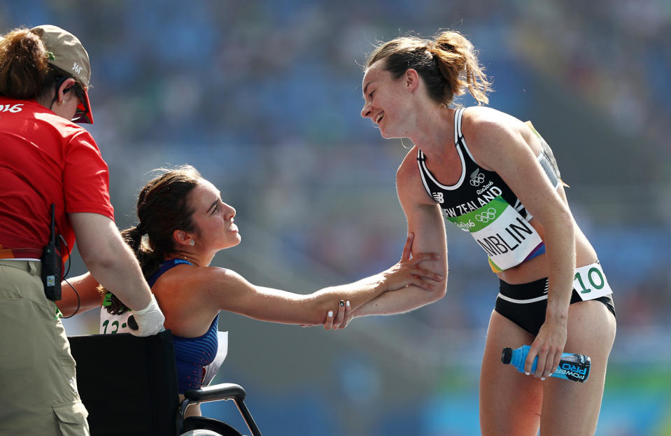 <p>Abbey D’Agostino of the United States (L) talks with Nikki Hamblin of New Zealand after the Women’s 5000m Round 1 – Heat 2 on Day 11 of the Rio 2016 Olympic Games at the Olympic Stadium on August 16, 2016 in Rio de Janeiro, Brazil. (Photo by Patrick Smith/Getty Images) </p>