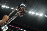 UTSA players and fans are reflected as they celebrate with the championship trophy after an NCAA college football game in the Conference USA Championship against Western Kentucky, Friday, Dec. 3, 2021, in San Antonio. (AP Photo/Eric Gay)