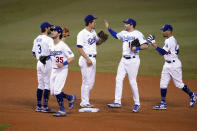 The Los Angeles Dodgers celebrate a 5-1 win over the Oakland Athletics in a baseball game Thursday, Sept. 24, 2020, in Los Angeles. (AP Photo/Marcio Jose Sanchez)