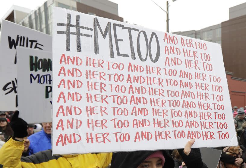 Protester carries a #MeToo sign