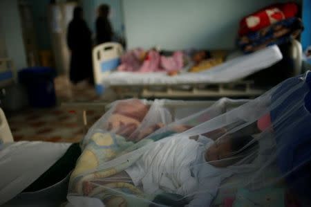 Iraqi children lies in beds at a hospital run by Medecins Sans Frontieres (MSF) in Qayyara, Iraq April 6, 2017. Picture taken April 6, 2017. REUTERS/Suhaib Salem