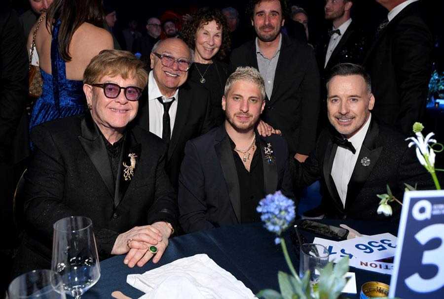 (Left to Right) Elton John, Danny DeVito, Rhea Perlman, Andrew Watt, Jake DeVito and David Furnish happily gather for the Elton John AIDS Foundation’s 32nd Annual Academy Awards Viewing Party in West Hollywood. (Michael Kovac/Getty Images for Elton John AIDS Foundation)
