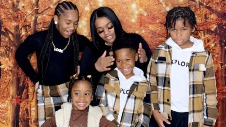 Candace Powell and her children are pictured in 2022.