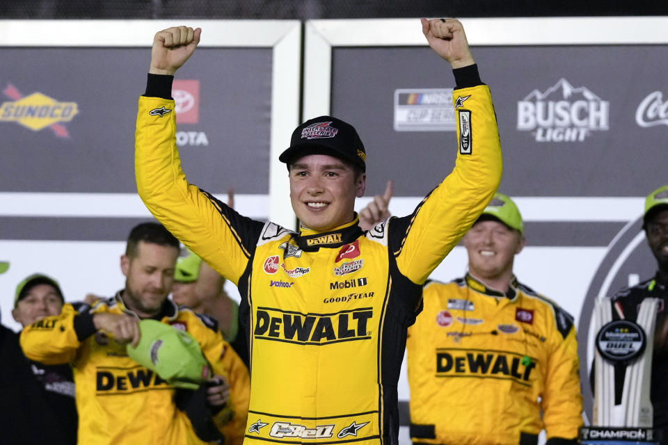 Christopher Bell celebrates in Victory Lane after winning the second of the two NASCAR Daytona 500 qualifying auto races at Daytona International Speedway, Thursday, Feb. 15, 2024, in Daytona Beach, Fla. (AP Photo/John Raoux)