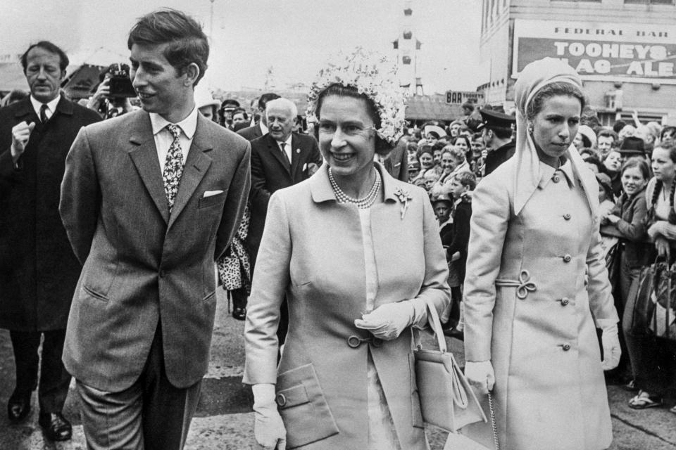 Queen Elizabeth II with the Princess Royal and the Prince of Wales as they passed through the crowds at the Royal Easter Show in Sydney during the Royal Tour of Australasia on April 3, 1970. (Press Association via AP file)