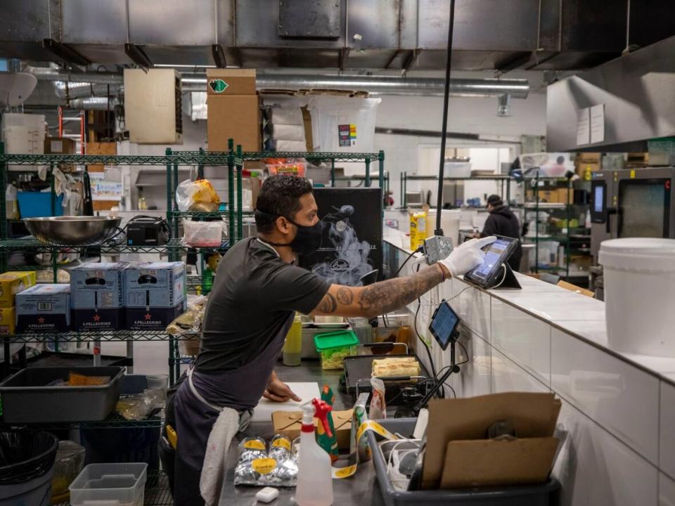A ghost kitchen, which caters only to takeout and delivery orders, is pictured in a   shared commissary kitchen in an East Vancouver warehouse on Monday.  (Ben Nelms/CBC - image credit)