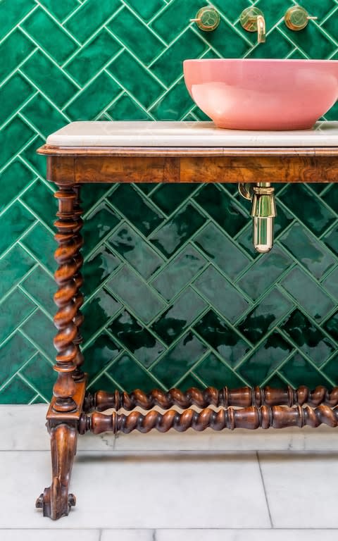 A wooden table repurposed as a washstand by interior designer Lucy Barlow