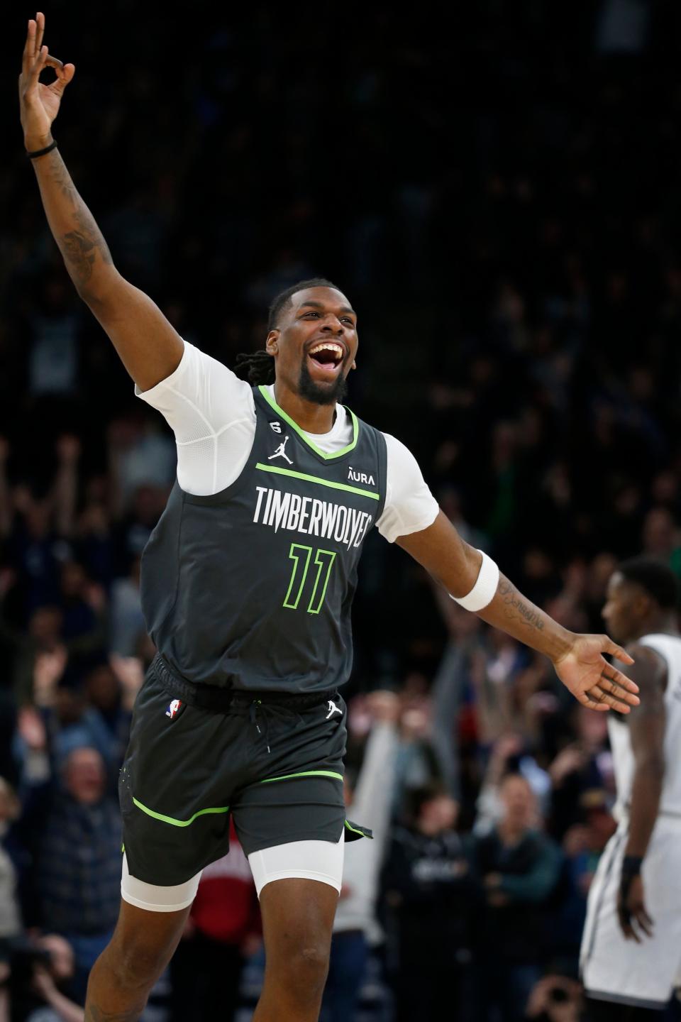 Minnesota Timberwolves center Naz Reid celebrates after his three-point basket at the buzzer to send the game into overtime against the Brooklyn Nets at an NBA basketball game Friday, March 10, 2023, in Minneapolis. (AP Photo/Bruce Kluckhohn)