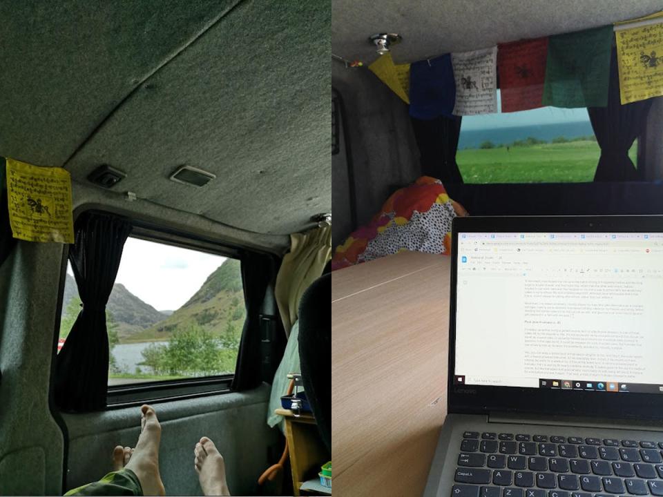 two pairs of feet in front of the windows of the van with navy curtains next to a photo of the writer's laptop on a table with the window and curtains in the background