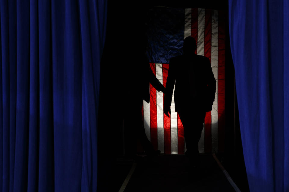 Staff members for President Donald Trump arrive on stage at the Crown Expo for a campaign rally, Monday, Sept. 9, 2019, in Fayetteville, N.C. (AP Photo/Evan Vucci)