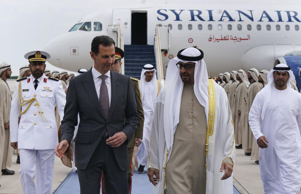 FILE - In this photo released by the Syrian Presidency, Syrian President Bashar Assad, left, speaks with UAE President Sheikh Mohammed bin Zayed Al-Nahyan, in in Abu Dhabi, United Arab Emirates, Sunday, March 19, 2023. With momentum moving toward a likely readmission of Syria to the Arab League, Syrians in government-held areas are hoping that political normalization will ease an economic crisis and lead to foreign investment and better living conditions.(Syrian Presidency via AP, File)