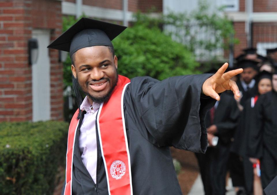 Ronald Temple, of Brockton, acknowledges his family during the Eastern Nazarene College 100th commencement in Quincy, Saturday, May 7, 2022.