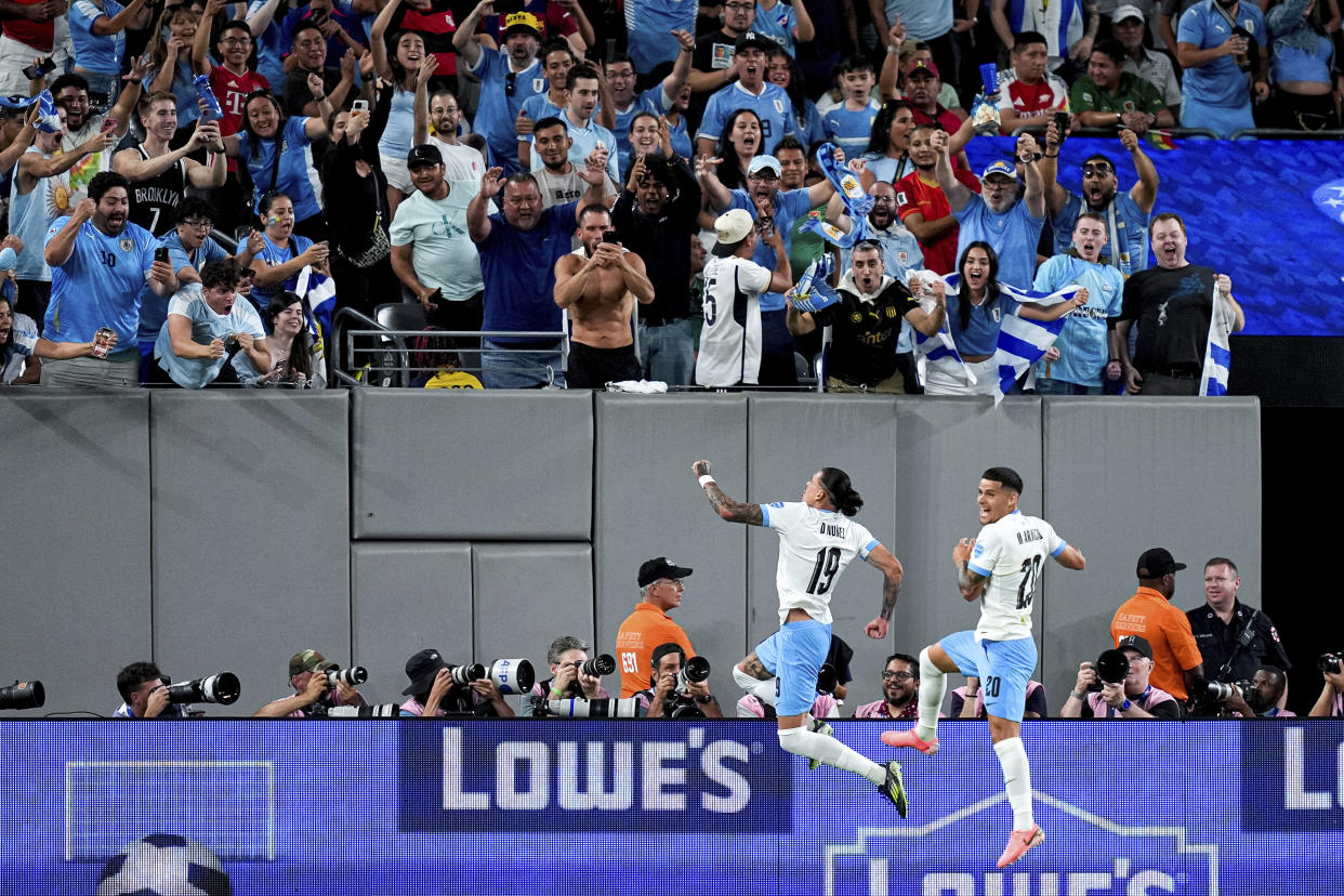 Uruguay's Darwin Nunez and Maximiliano Araújo celebrate after Nunez scored the team's second goal during a Copa America Group C soccer match against Bolivia in East Rutherford, N.J., Thursday, June 27, 2024. (AP Photo/Julia Nikhinson)