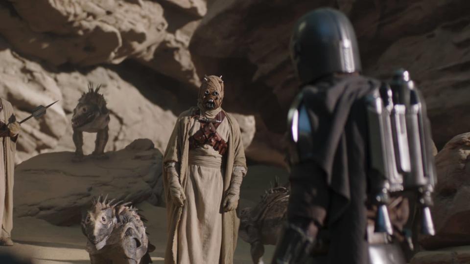THE MANDALORIAN, from left: Tusken Raider, Pedro Pascal (back to camera - as the Mandalorian), &#39;Chapter 9: The Marshal&#39;, (Season 2, ep. 201, aired Oct. 30, 2020). photo: Disney+/Lucasfilm / Courtesy Everett Collection