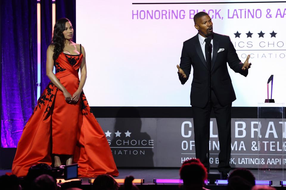 "It's crazy; I couldn't do that six months ago. I couldn't actually walk," Foxx said after Jurnee Smollett (left) presented him with the Vanguard Award on Monday night.