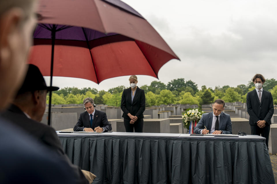 U.S. Secretary of State Antony Blinken, left, and German Minister of Foreign Affairs Heiko Maas, right, sign an agreement during a ceremony for the launch of a U.S.-Germany Dialogue on Holocaust Issues at the Memorial to the Murdered Jews of Europe in Berlin, Thursday, June 24, 2021. Blinken is on a week long trip in Europe traveling to Germany, France and Italy. (AP Photo/Andrew Harnik, Pool)